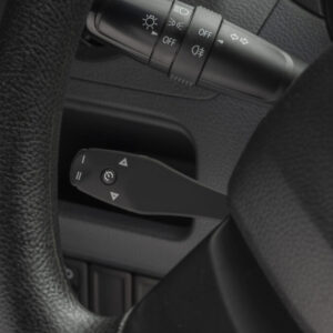 A CM35 Cruise Control Command Module neatly fitted and integrated into a vehicle's interior for convenient speed control.